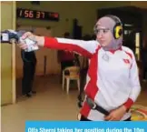  ??  ?? Olfa Sherni taking her position during the 10m air pistol competitio­n.