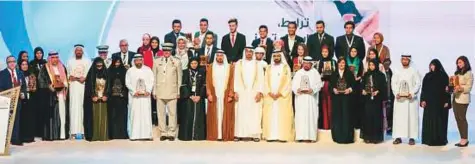  ?? WAM ?? Shaikh Mohammad Bin Rashid and Shaikh Mohammad Bin Zayed with the winners of the Shaikha Fatima Bint Mubarak awards.