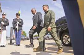  ?? AP PHOTO/ANDREW HARNIK ?? Secretary of Defense Lloyd Austin greets Ukrainian President Volodymyr Zelenskyy on Sept. 21 during a welcoming ceremony at the Pentagon in Washington.