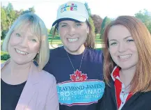  ??  ?? YMCA director of fund developmen­t Cathryn France, Justine Hayman of Raymond James and Janine Davies of the board of directors hit the links in support of the First Tee program.