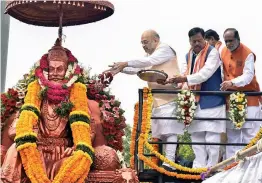  ?? — PTI ?? BJP president Amit Shah pays floral tributes to Maharaja Agrasen on the occasion of Maharaja Agrasen Jayanti in Hyderabad on Wednesday.