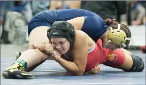  ?? BEA AHBECK/NEWS-SENTINEL ?? Lodi's Raven Edwards wrestles Central catholic's Faalia Martinez during their 137 pound match during the Sac-Joaquin Section Wrestling Masters Tournament at Stockton Arena on Saturday.