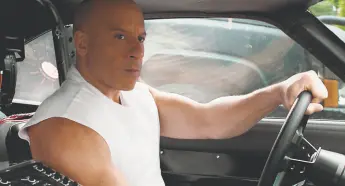  ?? Universal Pictures ?? Vin Diesel in “F9: The Fast Saga.” His look is extreme — a shaved head and big muscles — but he’s believable and wellpaired with Michelle Rodriguez.