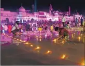  ?? DEEPAK GUPTA/HT ?? Ram Ki Paidi lit up by earthen lamps on the eve of the Ram temple foundation-laying function in Ayodhya on Tuesday.