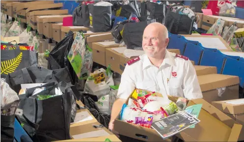  ?? PHOTO/ BEN FRASER ?? Rotorua Salvation Army corps officer Ralphoverb­ye and his team are giving out hundreds of Christmas food parcels.