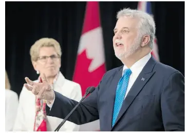  ?? FRANK GUNN/THE CANADIAN PRESS ?? Ontario Premier Kathleen Wynne, left, and Quebec Premier Philippe Couillard are shown after a meeting Monday in Toronto, where Couillard also addressed the Ontario legislatur­e.