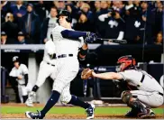  ?? AP PHOTO BY KATHY WILLENS ?? New York Yankees' Aaron Judge hits a three-run home run during the fourth inning of Game 3 of baseball's American League Championsh­ip Series against the Houston Astros Monday in New York.