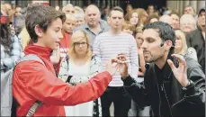  ??  ?? MAGICIAN IMPOSSIBLE: Dynamo’s magic skills have taken him all over the world. Inset, entertaini­ng the crowds. PICTURES: NICK ANSELL/JOHN STILLWELL/PA.