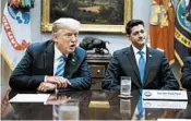  ?? EVAN VUCCI/AP ?? House Speaker Paul Ryan, R-Wis., showed the president glossy photos of a wall being built along the U.S.-Mexico border.