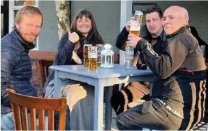  ??  ?? ●●Alex Cully, Phil and Karen Thomas and Paul Barlow enjoying the sunshine at The Kenilworth in Cheadle Hulme.