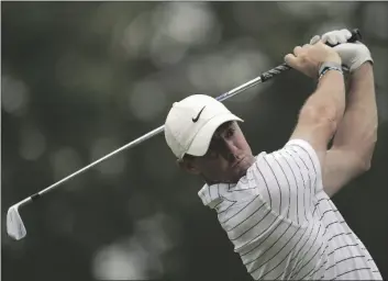  ?? SUE OGROCKI/AP ?? Rory McIlroy, of North Ireland, watches his tee shot on the 12th hole during a practice round for the PGA Championsh­ip golf tournament on Tuesday in Tulsa, Okla.