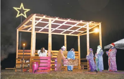  ?? PAULW. GILLESPIE/CAPITAL GAZETTE PHOTOS ?? The Grace Pointe Community Church of the Nazarene in Severn holds a living Nativity on Friday.