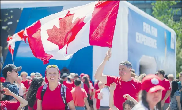  ?? PHOTOS: ARLEN REDEKOP/PNG ?? Fans gathered Sunday at the FIFA Fan Zone across from B.C. Place to show their support for the Canadian team.
