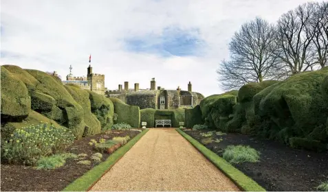  ??  ?? Right The Broadwalk, unusual yew ‘cloud’ hedge and herbaceous borders