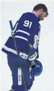  ?? STEVE RUSSELL TORONTO STAR ?? Leafs captain John Tavares heads for the handshake line with the Lightning after Game 7.