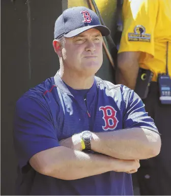  ?? AP PHOTO ?? SOUR PUSS: Red Sox manager John Farrell reacts as he watches from the dugout during yesterday’s beatdown by the Oakland Athletics.