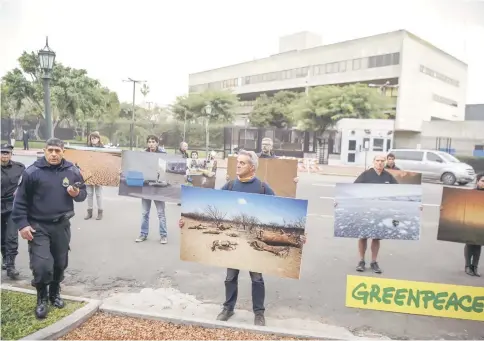  ??  ?? Greenpeace activists demonstrat­e outside the US embassy in Buenos Aires, Argentina, against Trump’s decision that his country, the world’s second largest emitter of greenhouse gases, would pull out of the 2015 Paris climate agreement.