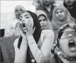  ?? CARSTEN KOALL/GETTY IMAGES ?? Students shout slogans in front of Cairo University during a protest against the military rulers of the country, in Cairo.