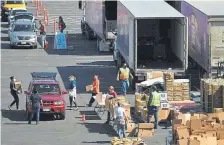  ?? RJ Sangosti, The Denver Post ?? The Denver Broncos and Food Bank of the Rockies hosted a mobile pantry at Empower Field at Mile High on April 27 to help people in need during the pandemic.