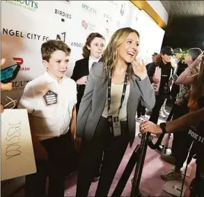  ?? Getty Images / Getty Images ?? National Women’s Soccer League commission­er Jessica Berman and her family walks the Pink carpet prior to a inaugural NWSL match at the Banc of California Stadium in Los Angeles on April 29.