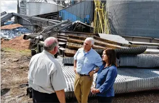  ?? HYOSUB SHIN / HSHIN@AJC.COM ?? Vice President Mike Pence and his wife Karen Pence meet with an employee of Flint River Mills in Bainbridge on Tuesday. Pence and his wife traveled to Georgia to speak to farmers about their losses after Hurricane Michael the day after President Donald Trump visited Macon.