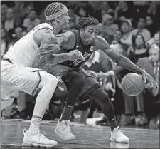  ?? KATHY WILLENS/AP PHOTO ?? Knicks forward Michael Beasley, left, defends against Nets forward Rondae Hollis-Jefferson (24) in the second half of Thursday’s game.