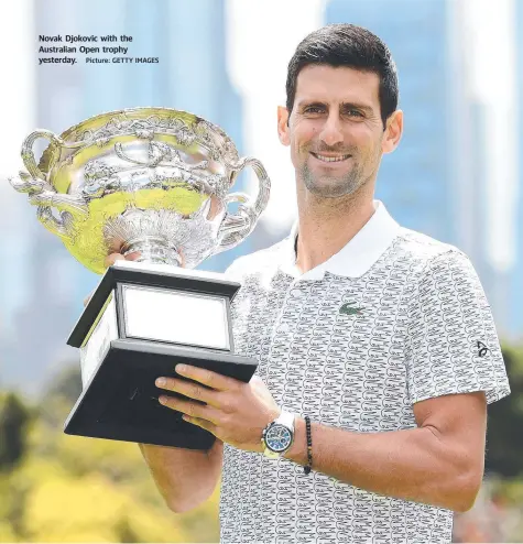  ?? Picture: GETTY IMAGES ?? Novak Djokovic with the Australian Open trophy yesterday.