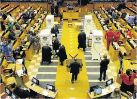  ??  ?? COUNTDOWN STARTS: Voting stations are set up in the National Assembly yesterday before the motion of no confidence against President Jacob Zuma