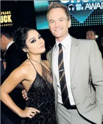  ??  ?? By Michael Buckner, Getty Images, for PCA How I met Vanessa Hudgens: The actress greets Neil Patrick Harris, who took home the trophy for favorite actor in a TV comedy.