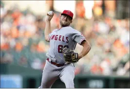  ?? JULIO CORTEZ – THE ASSOCIATED PRESS ?? The Angels' Chase Silseth. making his sixth start of the season, pitched four-plus innings, allowing four runs, six hits and a walk, against the Orioles on Thursday night in Baltimore.