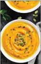  ?? GETTY IMAGES ?? Herby pepitas top this bowl of creamy curried pumpkin soup.