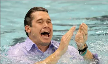  ??  ?? In this 2011 file photo, California head coach Dave Durden celebrates after winning the team title at the NCAA Men’s Swimming &amp; Diving Championsh­ips at the University of Minnesota, in Minneapoli­s. AP PhoTo/AnDy KIng