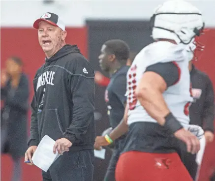  ?? MATT STONE/THE COURIER JOURNAL ?? Louisville head football coach Jeff Brohm oversees practice April 12 ahead of the Red-White scrimmage game.