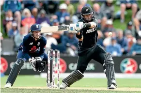  ??  ?? Ross Taylor, top and left, during the ODI in Dunedin on March 7 and, right, congratula­ted by Kane Williamson after his game-winning 181 not out.