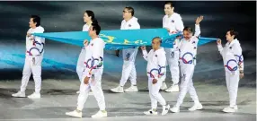  ??  ?? Legends of the game, top from left, Lydia de Vega-Mercado, Akiko Thomson-Guevarra, Eric Buhain, Alvin Patrimonio; below from left, Paeng Nepomuceno, Mansueto ‘Onyok’ Velasco, Efren ‘Bata’ Reyes and Bong Coo bear the SEA Games Federation Flag during the opening ceremonies of the 30th SEAG Saturday at the Philippine Arena in Bocaue, Bulacan. (Rio Deluvio)