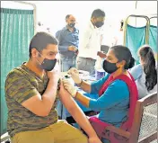  ??  ?? A health worker administer­s a Covid-19 vaccine in Gurugram, on Monday.