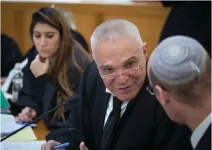  ?? (Noam Revkin/Flash90) ?? ATTORNEY YOSSI COHEN, representi­ng Prime Minister Benjamin Netanyahu and his wife, Sara, is seen at the High Court of Justice in Jerusalem yesterday.