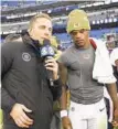  ?? NICK WASS/AP ?? CBS reporter Evan Washburn stands next to Ravens quarterbac­k Lamar Jackson after a victory over the Texans last season.