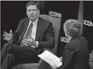  ?? SARAH GORDON THE DAY ?? James Comey speaks with UConn President Susan Herbst following a talk on Monday in Storrs.