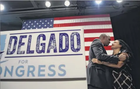  ?? Monica Jorge / the new York times ?? Antonio delgado, the democratic House candidate, kisses his wife, Lacey Schwartz delgado, during an election night party nov. 6 in Kingston. delgado defeated one-term rep. John J. faso.