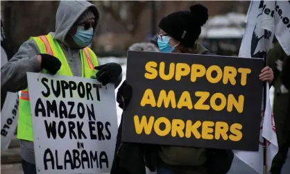  ??  ?? People in Union Square, New York, demonstrat­e in support of Amazon workers. Photograph: Kena Betancur/AFP/Getty Images