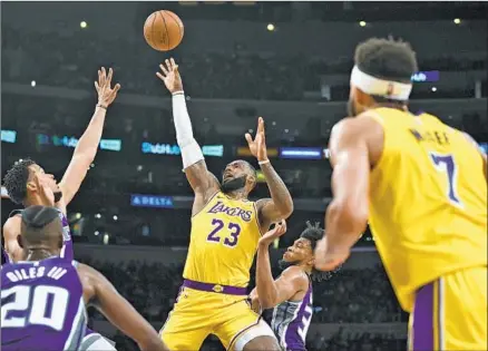  ?? Kelvin Kuo Associated Press ?? LeBRON JAMES and the new-look Lakers open their season Thursday night on the road against the Portland Trail Blazers.