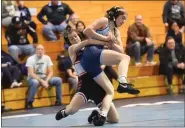  ?? MIKE CABREY — MEDIANEWS GROUP ?? Souderton’s Emily Sarr keeps a grip on North Penn’s Savannah Lanyi during their 121-pound match on Wednesday.