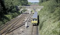  ?? AP photo ?? A train pulls into Hunts Cross Station, in Liverpool, England on Monday. Unions and train companies in Britain are set to hold last-minute talks Monday amid fading hopes of averting the country’s biggest rail strikes for decades.