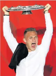  ?? /Reuters ?? Germany hopes: Joshua Kimmich celebrates winning the Bundesliga with Bayern Munich on Saturday. His attention will now turn to helping Germany retain the World Cup.