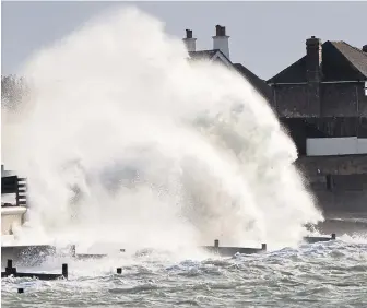  ??  ?? Giant waves batter the seafront at Selsey, West Sussex, during the storms yesterday