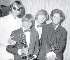  ?? ASSOCIATED PRESS ?? Mike Nesmith, Davy Jones, Peter Tork, and Micky Dolenz of The Monkees, from left, with their Emmy award for best comedy series in 1967.at the 19th Annual Primetime Emmy Awards in Los Angeles. Tork died Thursday, of complicati­ons related to cancer.