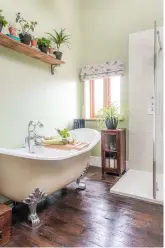  ??  ?? MAIN BATHROOM ‘A roll-tap bath here was a must,’ says Pollyanna. Try the Polperro slipper bath, £1,235, The Cast Iron Bath Company. Walls in Cooking Apple Green modern emulsion, £53 for 2.5ltr, Farrow & Ball