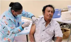  ?? Photo: Office of the President, Palau ?? Palau’s former President, Tommy Remengesau, receives his COVID-19 vaccinatio­n in January 2021.