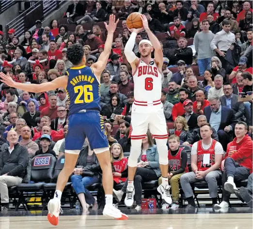  ?? ?? Bulls guard Alex Caruso had 12 points and went 5-for-10 from the field, including 2-for-5 from three-point range, against the Pacers on Wednesday. NAM Y. HUH/AP